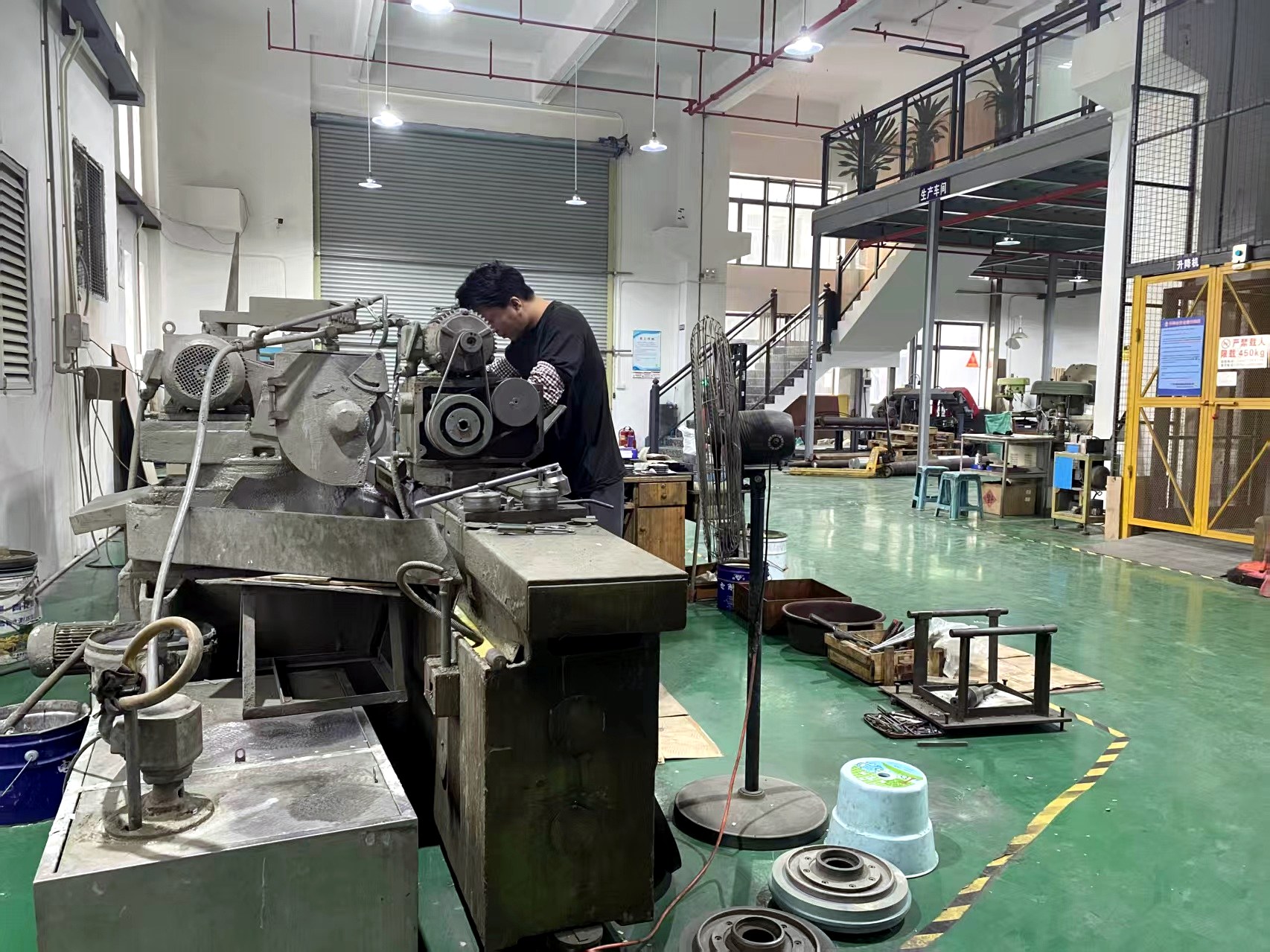 Operator machining a product